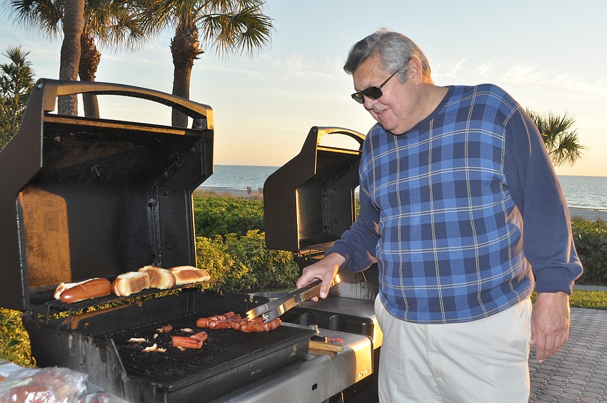 Robert Endres mans the grill at the Seaplace Super Bowl party.