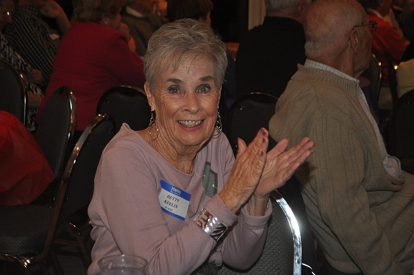 Betty Keelin applauds the Ravens defense during the first quarter at the Beachplace Super Bowl party.