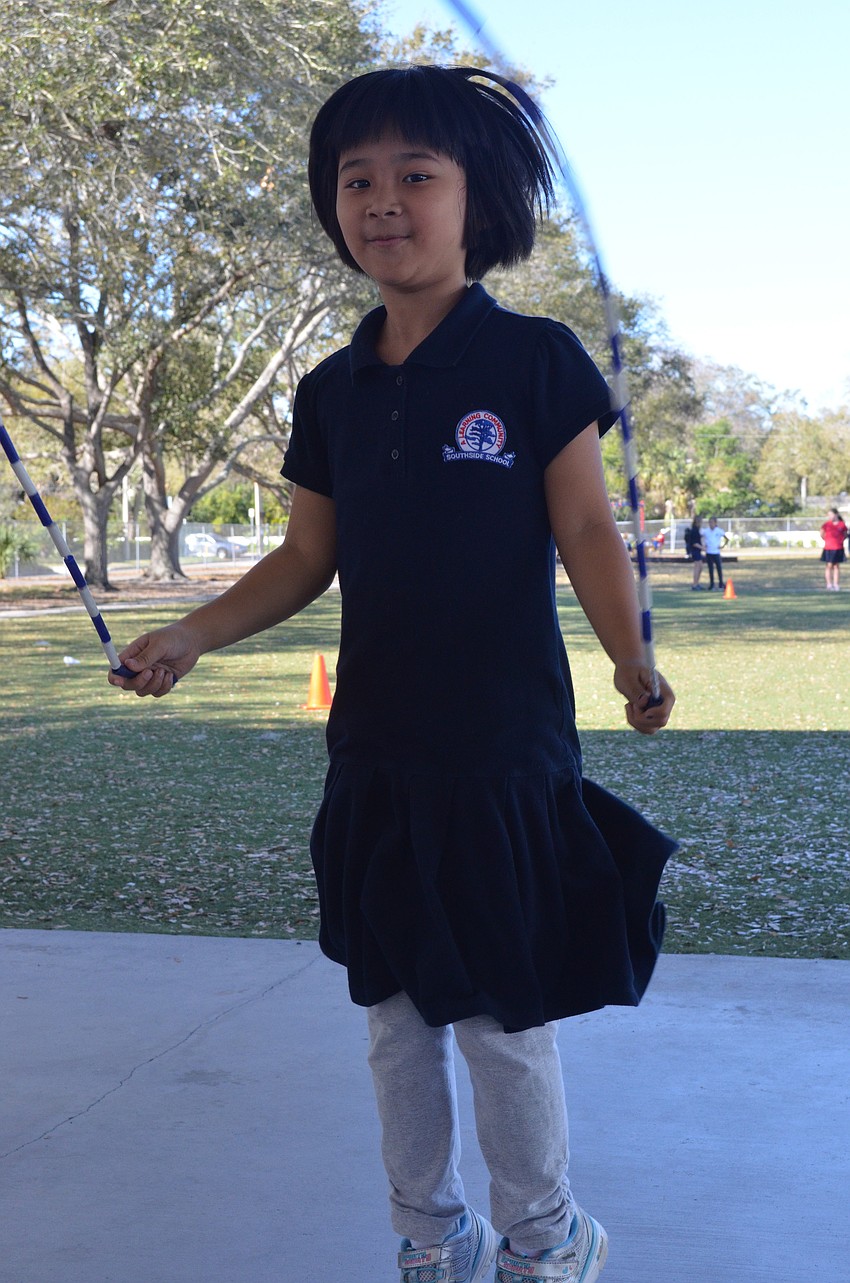 Angela Huang, 7, jumps rope during gym class.