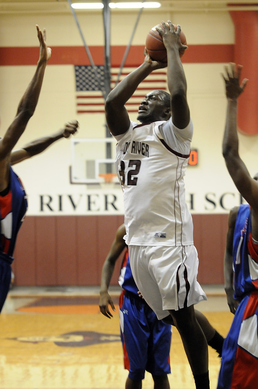 Braden River senior forward Trevon Young muscles his way up for a shot in the second quarter.