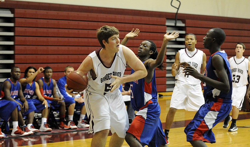 Braden River junior center Ryan Paice looks to the hoop for an open teammate.