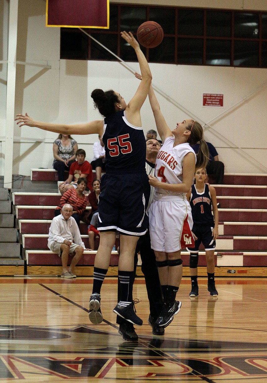 Indian Rocksâ€™ Rachel Boyette, No. 55, and Cardinal Mooneyâ€™s Emily Rzonea, No. 14, go for the jump ball.