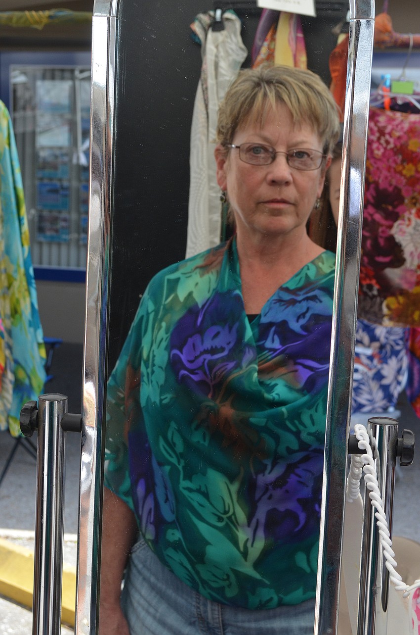 Cynthia Flynn from Massachusetts tries on a scarf shirt.