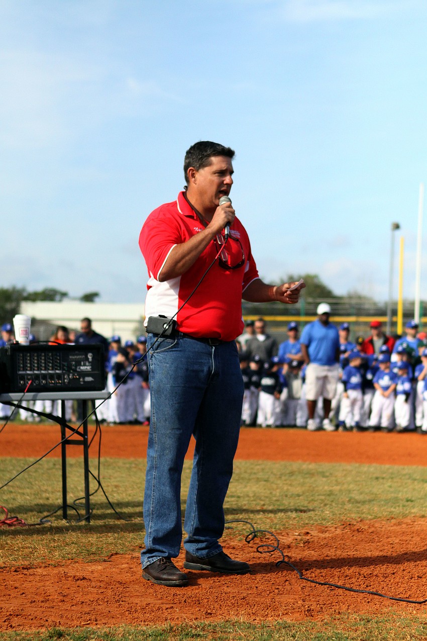 Neil Bain, President of Sarasota Little League, speaks to the 654 players as well as the coaches and parents who came out for opening day.