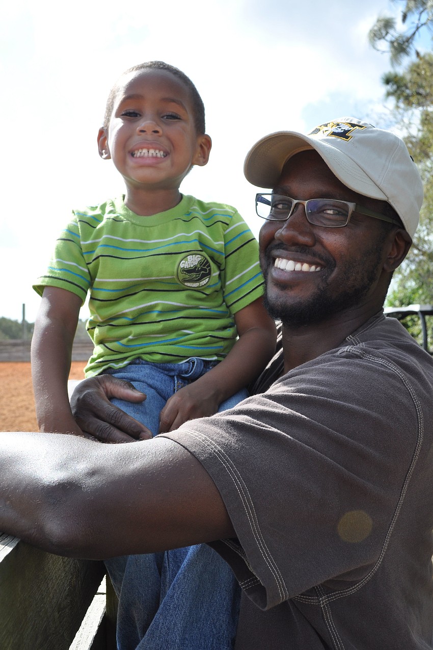 Isaiah Carter, 3, watched the action with his dad, Alex.