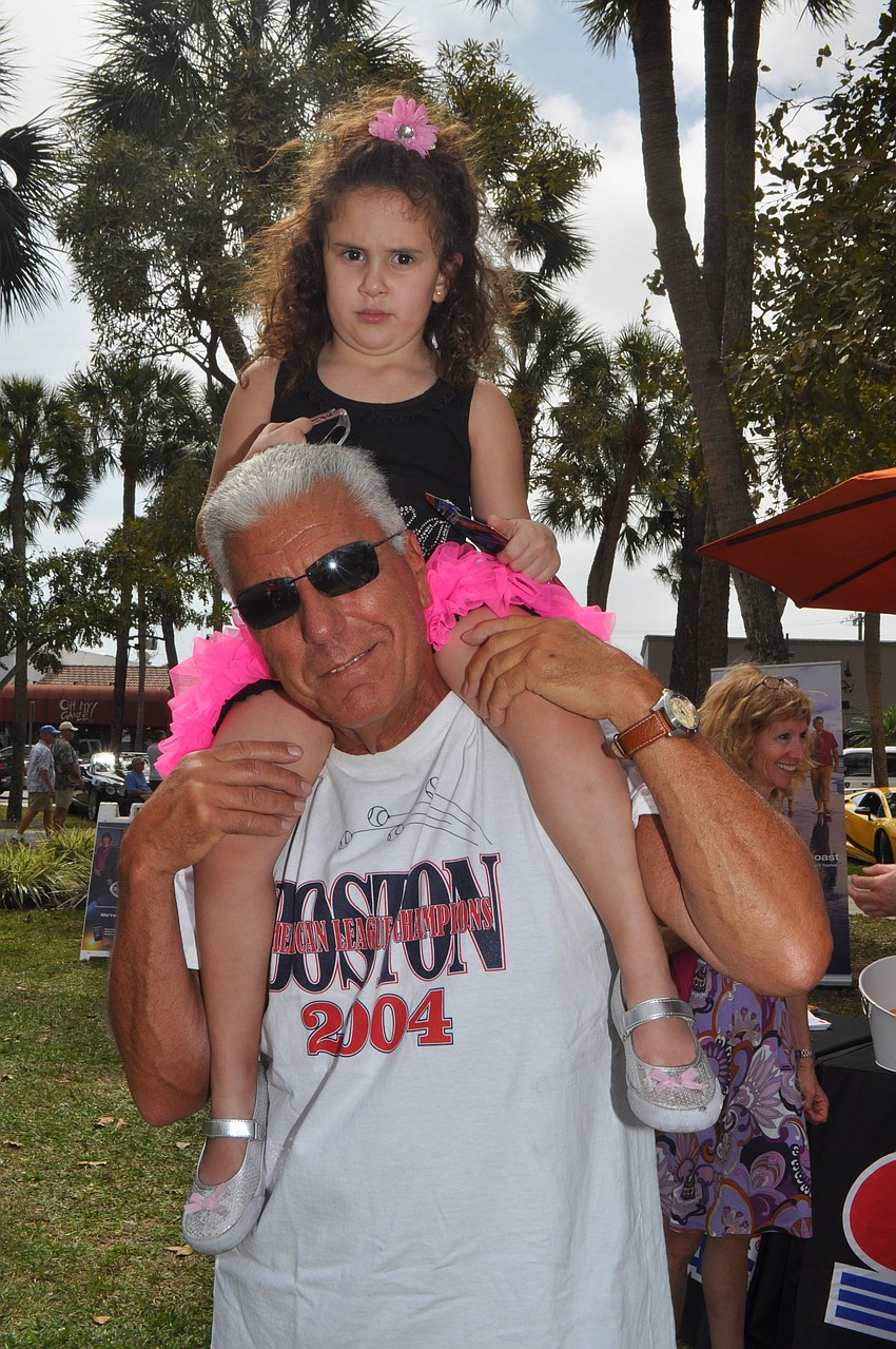 Joe Ferrara introduces his granddaughter, Giuliana Alvarez, 4, to the world of luxury vehicles.