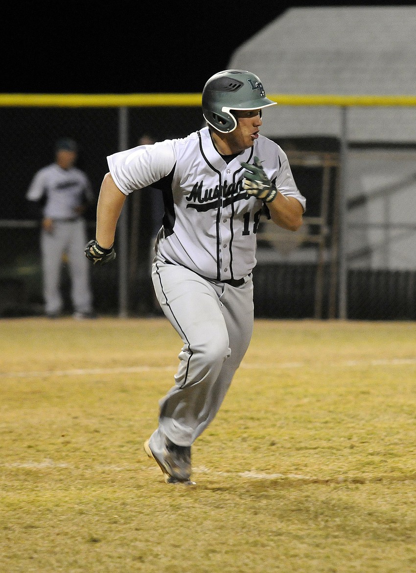 Lakewood Ranch senior Dennis McGinnis races down the first base line in the top of the fourth inning.