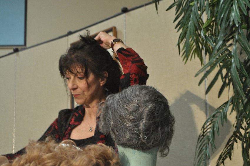 Carolyn Michel demonstrates how braiding her hair provides a blank canvas to apply a wig.