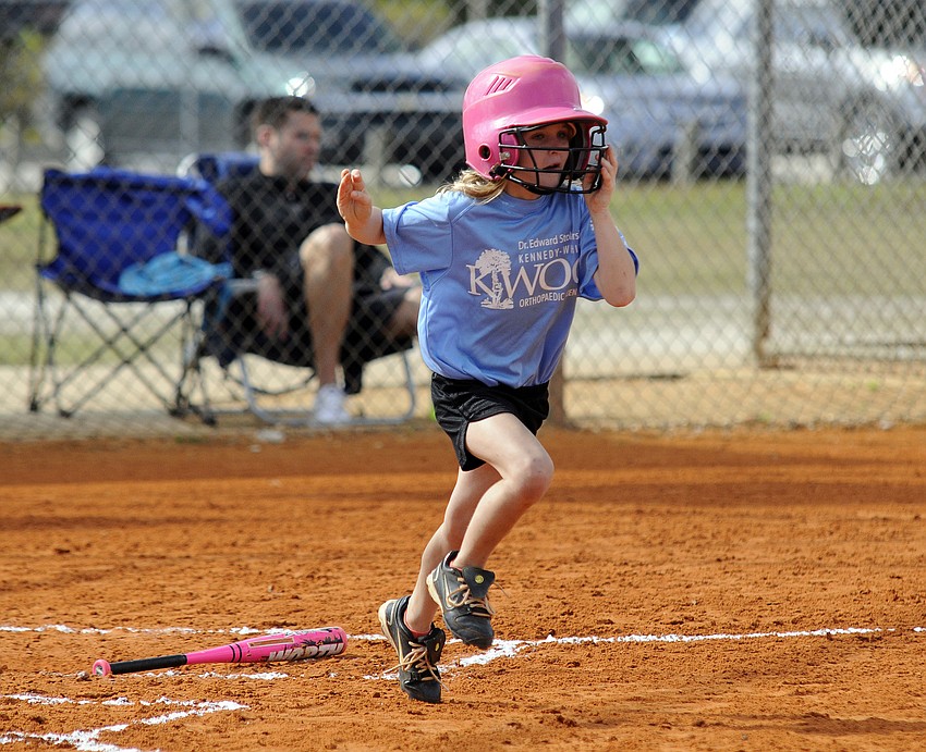 Six-year-old Nikki Koukouvas races to first base after hitting a single.