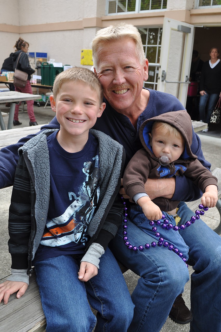 Rick Isom, center, enjoyed time with his grandchildren, Damon Mixon, left, and Evan Mixon, right.