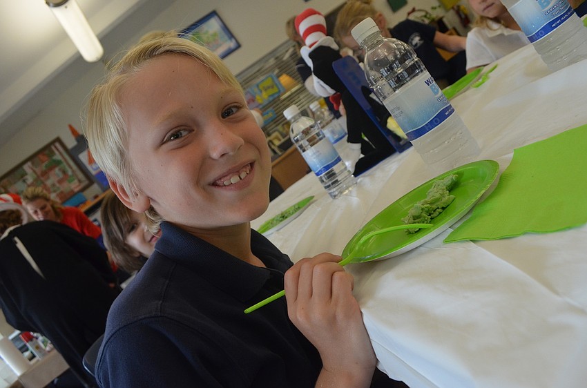 Trey, 7, gets ready to eat green eggs and ham.