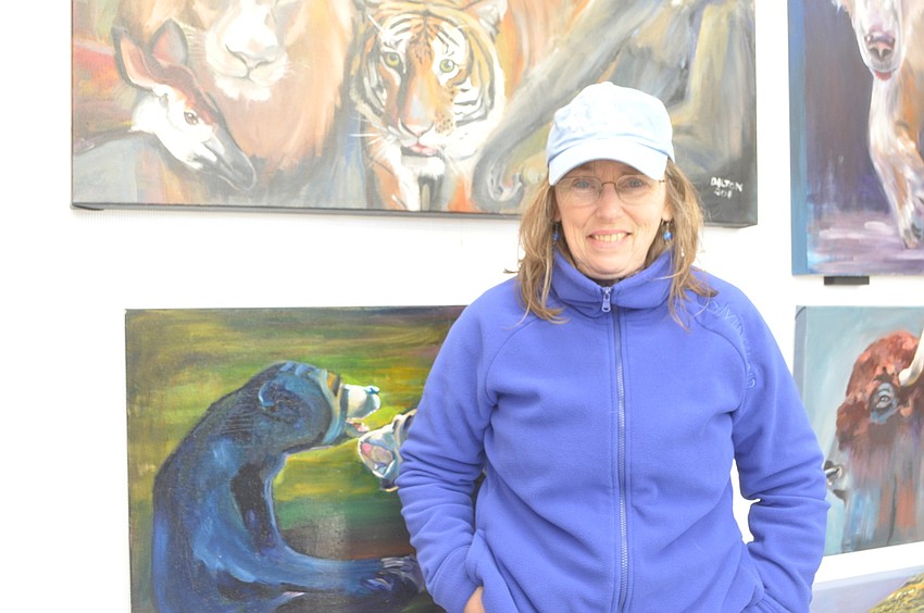 Ann Dalton spends six months a year photographing animals in Florida zoos to later paint.