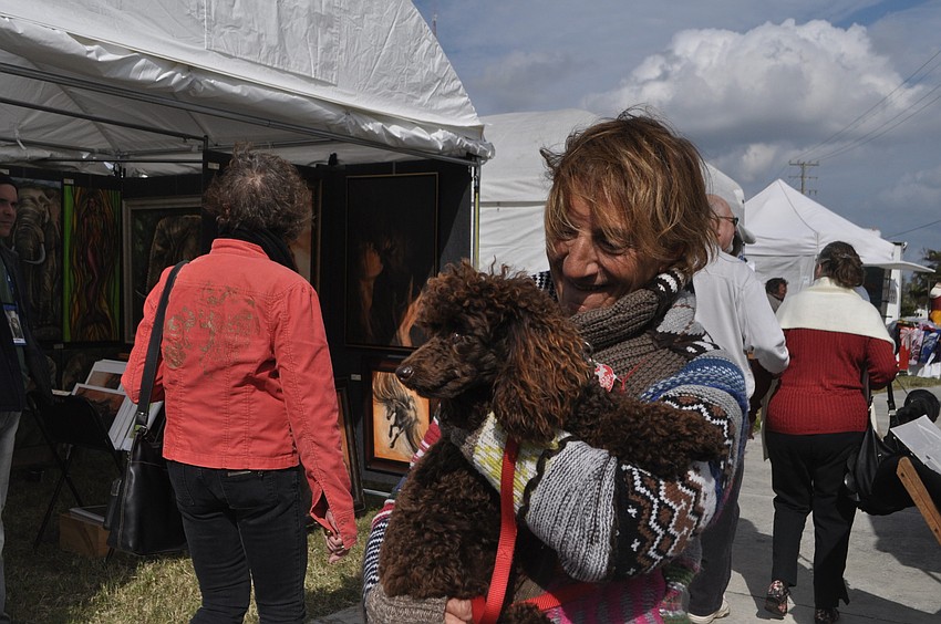 Terry Castleberry with Vinny, her miniature poodle