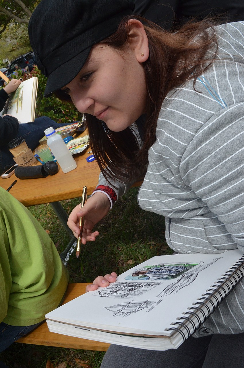 Booker High School freshmen Franchesca Alvarado is part of the Visual and Performing Arts art class and came to the art festival to draw.
