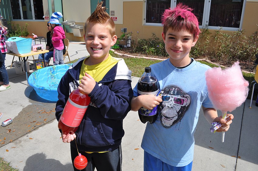 Blake Kelly and James Lowe won bottles of soda at a carnival game.