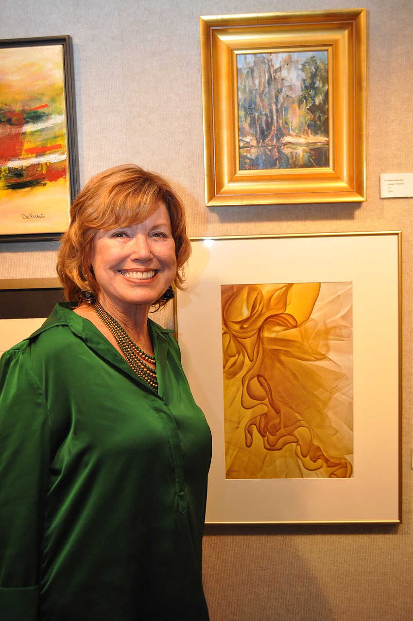 Gloria Newcomb and her photo â€œWedding Dressâ€ is on display in â€œSimply Originalâ€ in Gallery 4