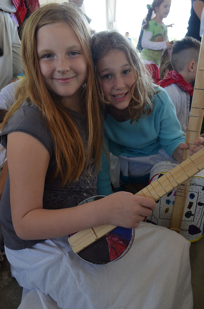 Maya Schroeder and Nicole Norwine get ready to watch the performance.