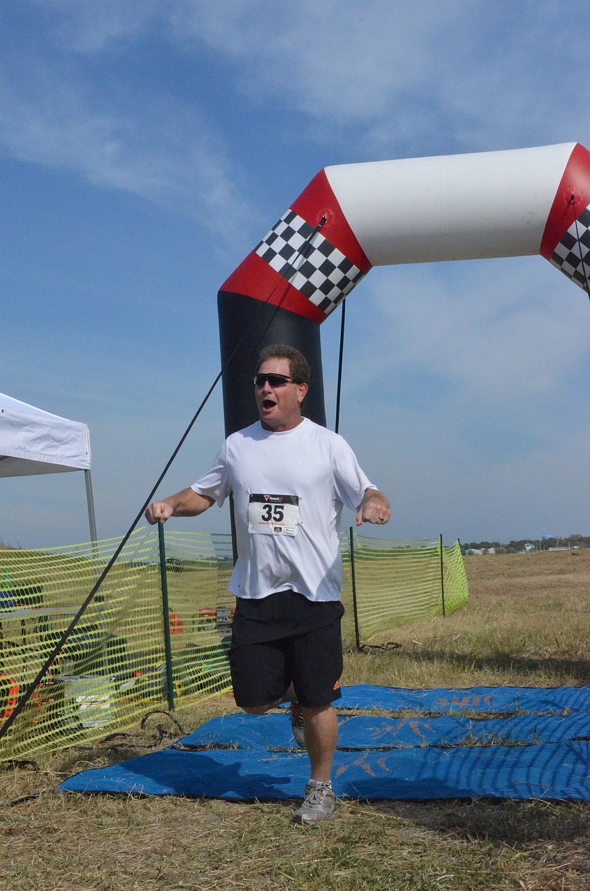 Jack Gorrill finishes the 5K run.