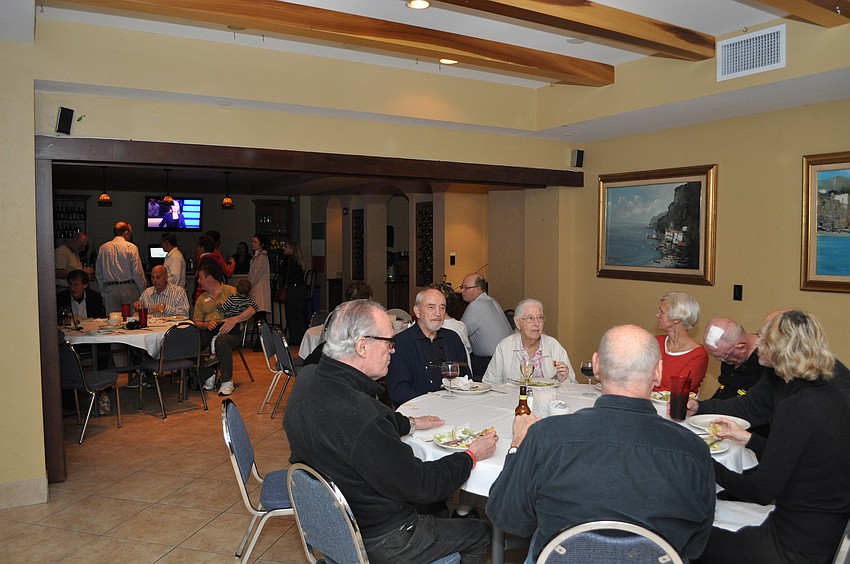 Family, friends and neighbors of Linda Holland filled the second floor of the Broadway Bar and Restaurant for her watch party.