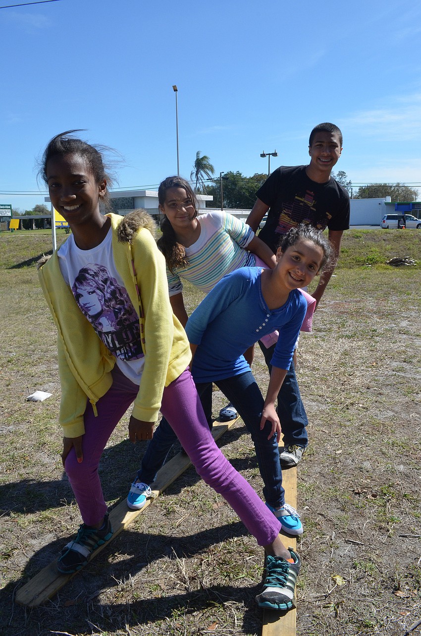 Alexis Yong, 11, plays a Hungarian game with her friend Mercedes Traba, 9, and her cousins Emily, 10, and Jesse Yong, 13.
