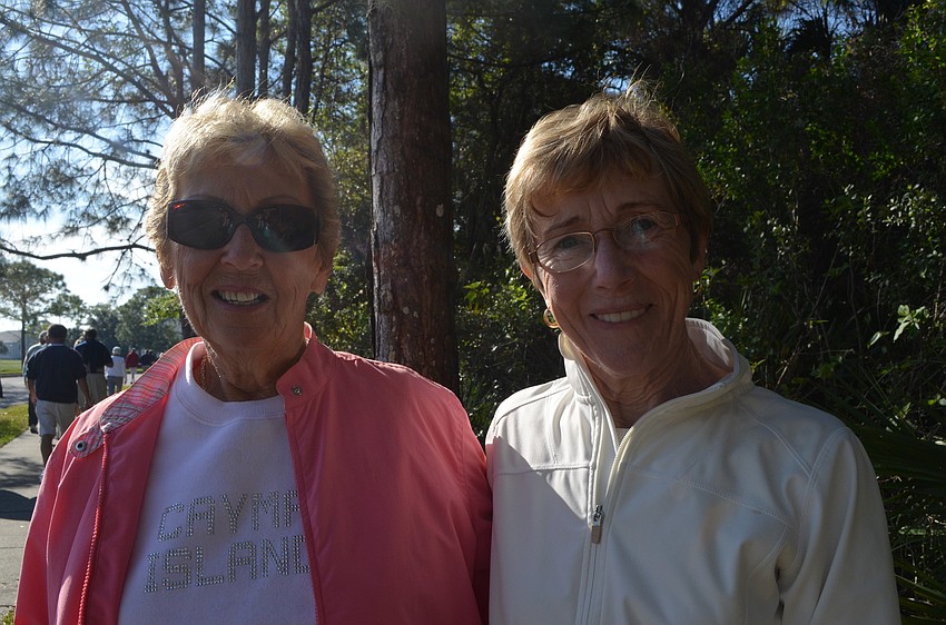 Barb Moore and and Mary McGee enjoy the morning walk with neighbors.