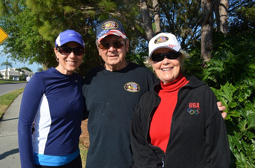 Karen Maudlin walks with her parents Roger and Lynne Grimshaw.