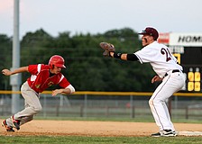 Cardinal Mooneyâ€™s Davis Roddenberry, No. 4, runs back towards first base while Riverviewâ€™s Kaidan Mafnas, No. 20, keep his glove open in hopes of tagging Roddenberry out.