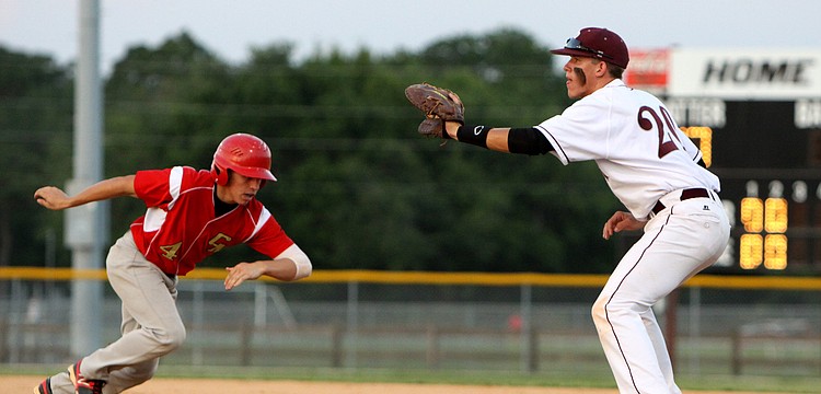 Cardinal Mooneyâ€™s Davis Roddenberry, No. 4, runs back towards first base while Riverviewâ€™s Kaidan Mafnas, No. 20, keep his glove open in hopes of tagging Roddenberry out.