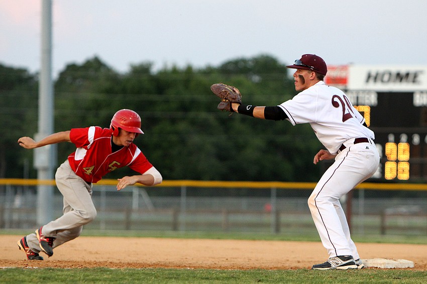 Cardinal Mooneyâ€™s Davis Roddenberry, No. 4, runs back towards first base while Riverviewâ€™s Kaidan Mafnas, No. 20, keep his glove open in hopes of tagging Roddenberry out.