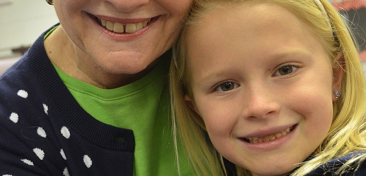 Megan Voigt shows her grandmother Deby Rutledge around her classroom.