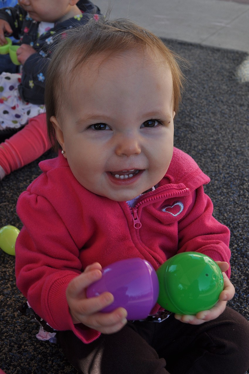 Brelynn Straub, 1, held as many eggs as she could.
