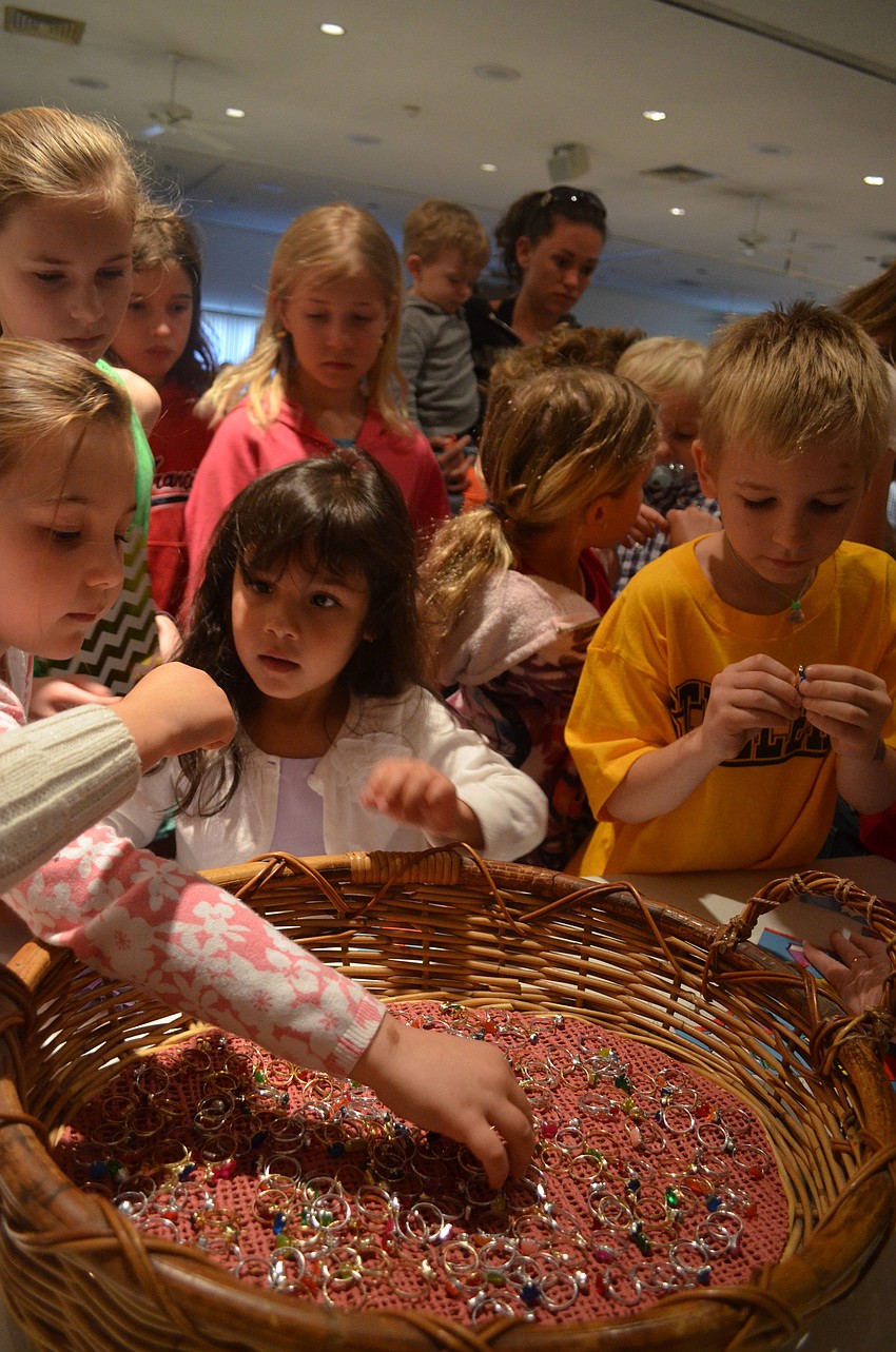 Granny Goose gives children friendship rings.
