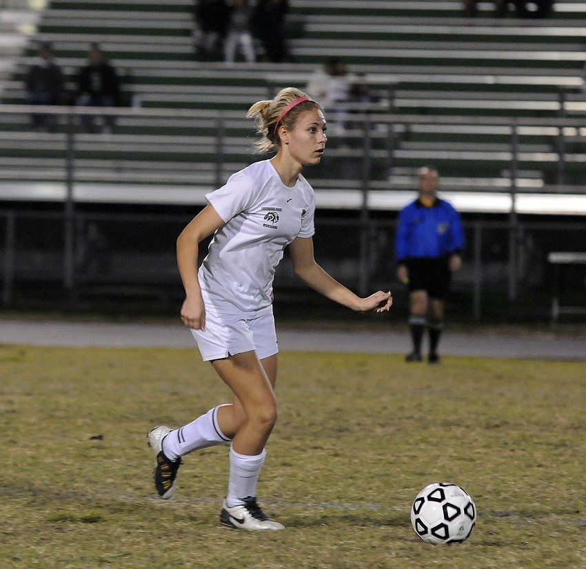 Lakewood Ranch High defender Amanda Baar pushes the ball up the field.