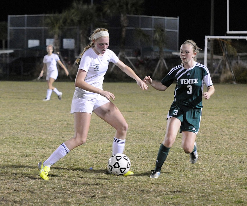 Lakewood Ranch midfielder Talia Falco battles a Venice opponent for possession in the second half.