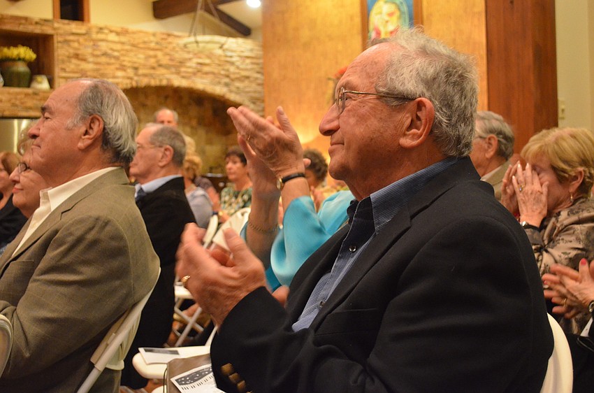 David Eisenberg applauds the performance.