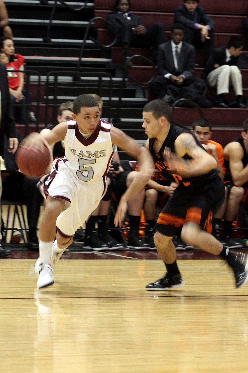 Riverviewâ€™s D.J. Brant, No. 5, attempts to dribble the ball past Sarasotaâ€™s Justin Robbens, No. 13.