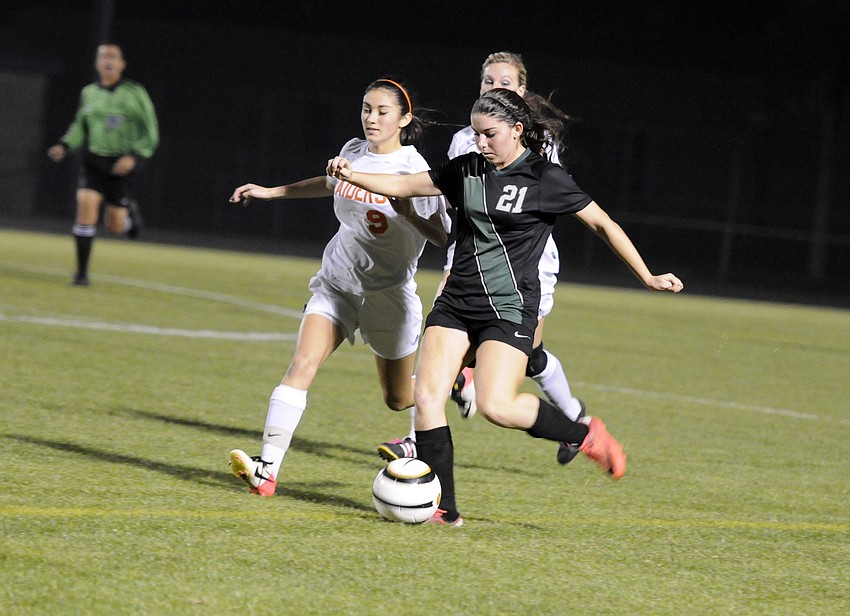 Lakewood Ranch forward Angelica Rego battles a Plant City defender for possession in the second half.