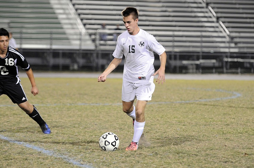 Lakewood Ranch defender Sean Fenton brings the ball back up to the midfield in the second half.