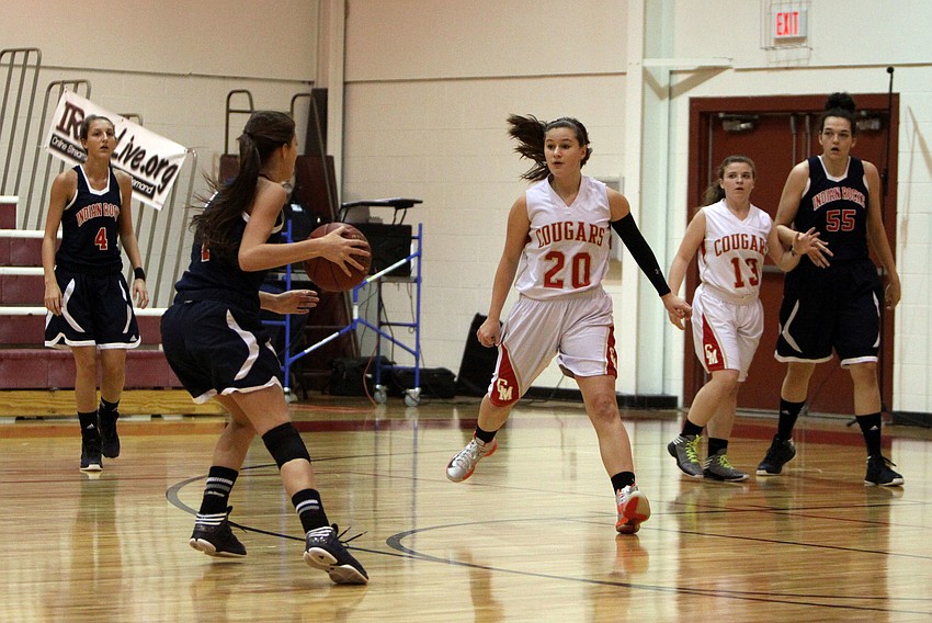 Indian Rocksâ€™ Brooke Morten, No. 1, tries to pass the ball while Cardinal Mooneyâ€™s Bridget Walsh, No. 20, stays close to guard.