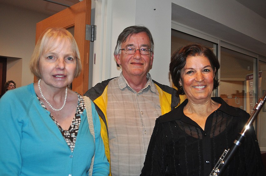Susan and Michael Dent, a flutist and guitar player, respectively, visit with Dr. Jane Hoffman after the performance.