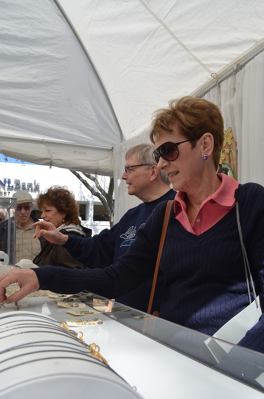 Joanne Darling browses through Nina Nomi handcrafted jewelry.