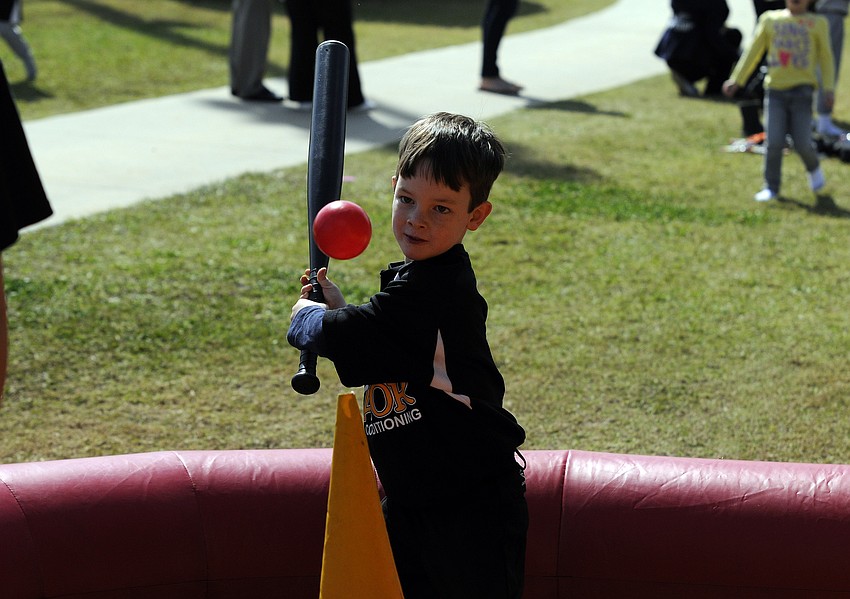 Four-year-old Alex Stablein enjoyed getting in a little extra batting practice.