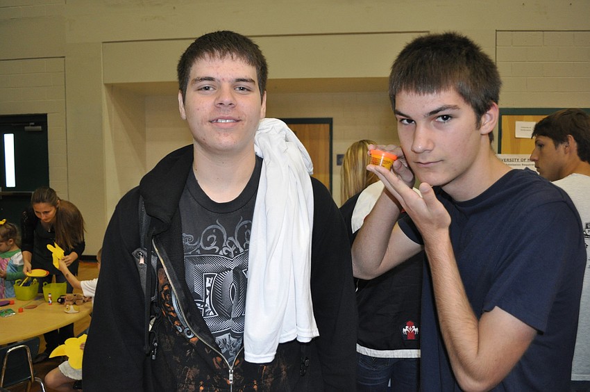 Nick Ungarelli, who is interested in attending Kaiser University, and John Castello, who enjoyed the free Play-Doh