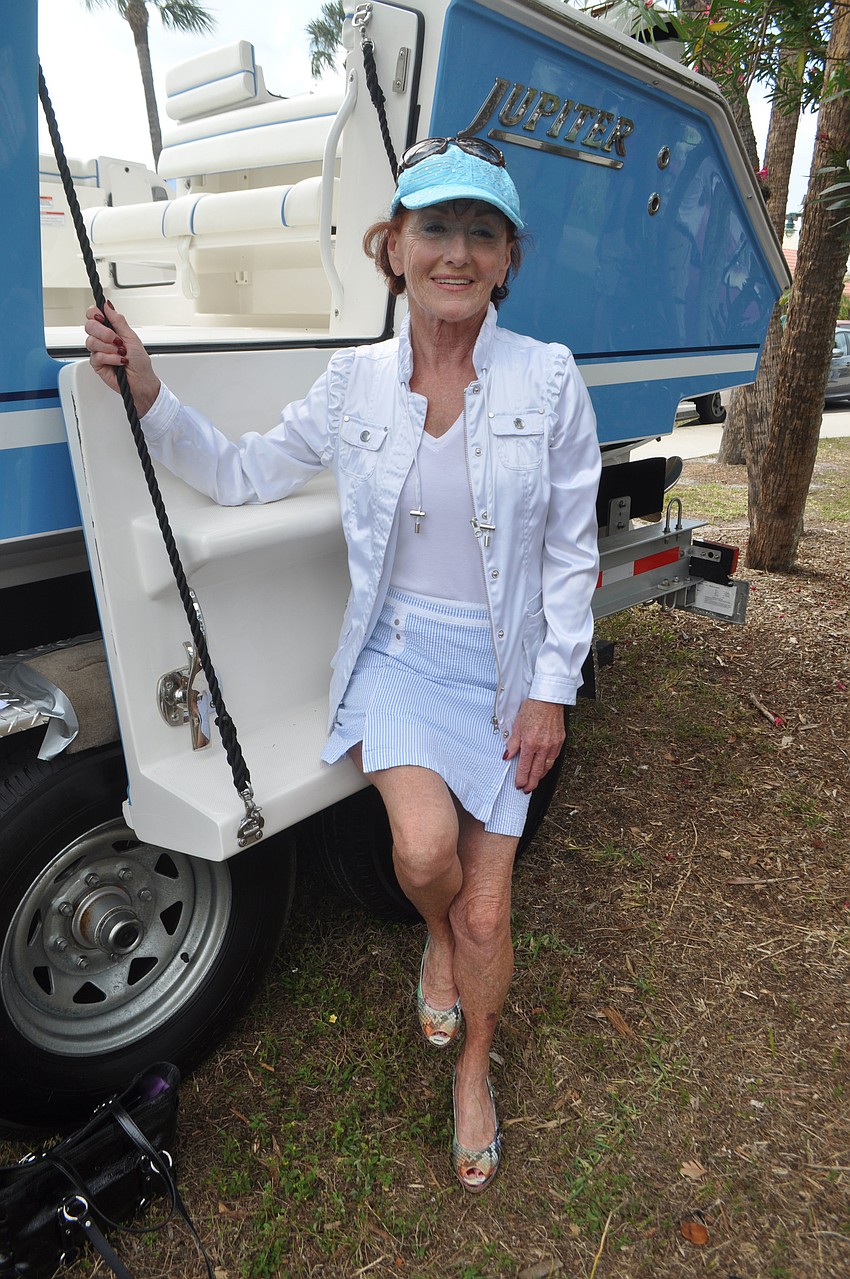 Micheline Cholette perches on a Jupiter boat.