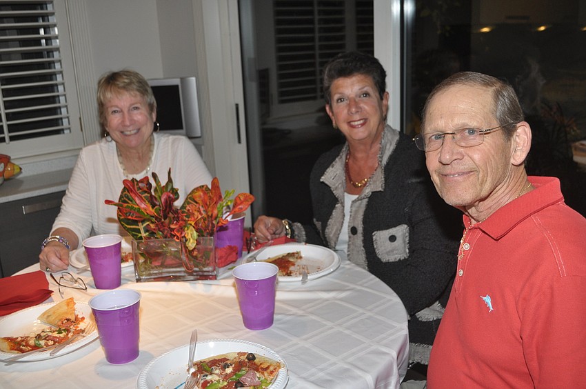 David Eskin, Judy Silver and Dale Sprintz cut into the desserts.