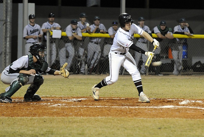 Braden River pitcher Eric Schappacher lays down a bunt in the first inning