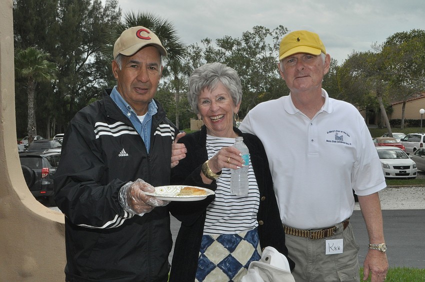 Mike Ortega, Jane Bagot and Ken Simpson volunteer at the sale