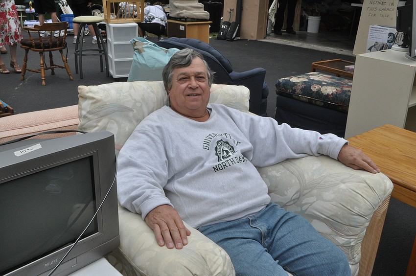 Tom Jendrysik tests out an arm chair