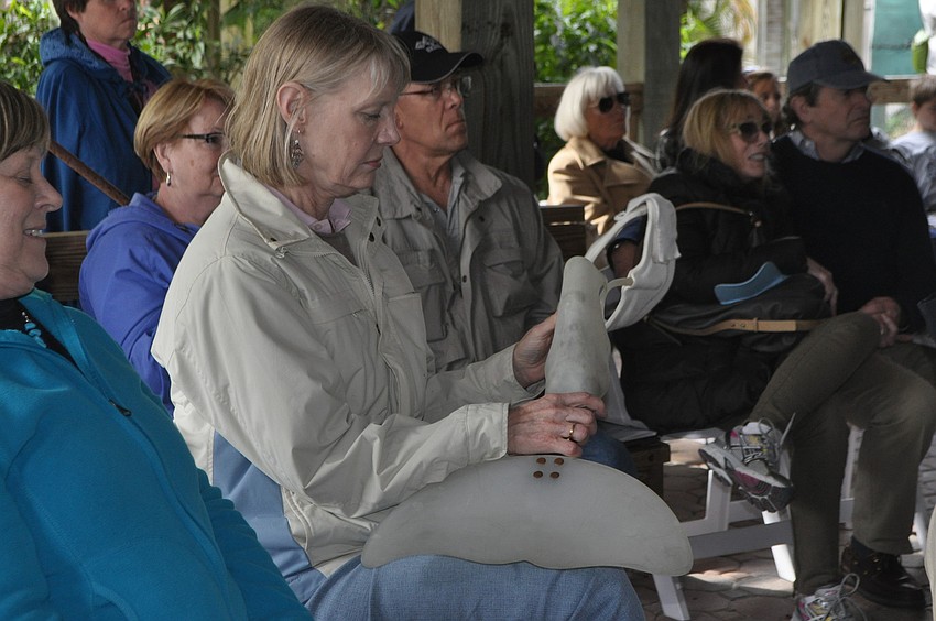 Joan Davenport holds Winterâ€™s former prosthetic tail.