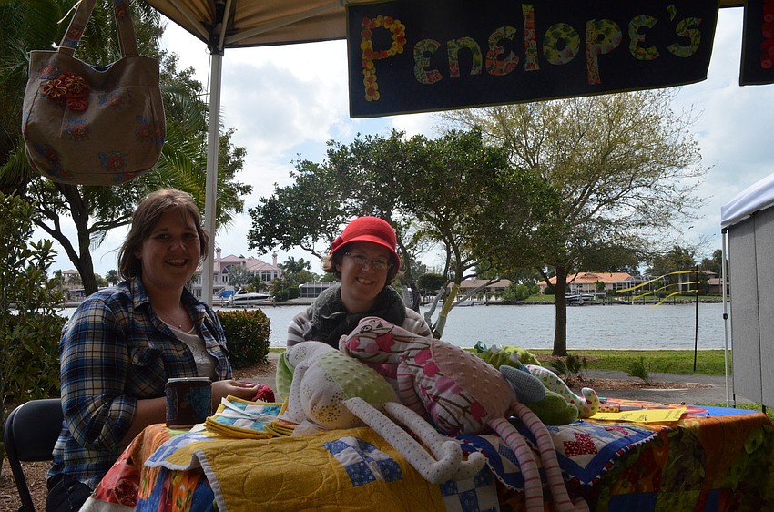 Amy Miller and Jessica Johnson sold quilts and knit scarves.